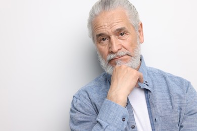 Portrait of handsome senior man on white background. Space for text