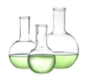 Photo of Glassware with liquids isolated on white. Laboratory analysis
