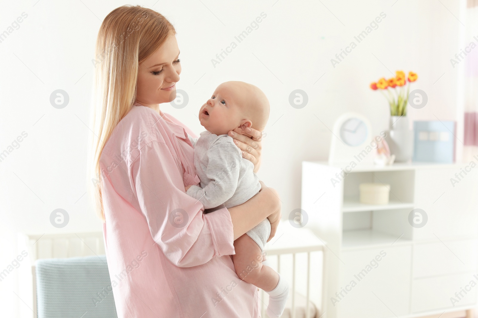 Photo of Happy mother and her baby at home