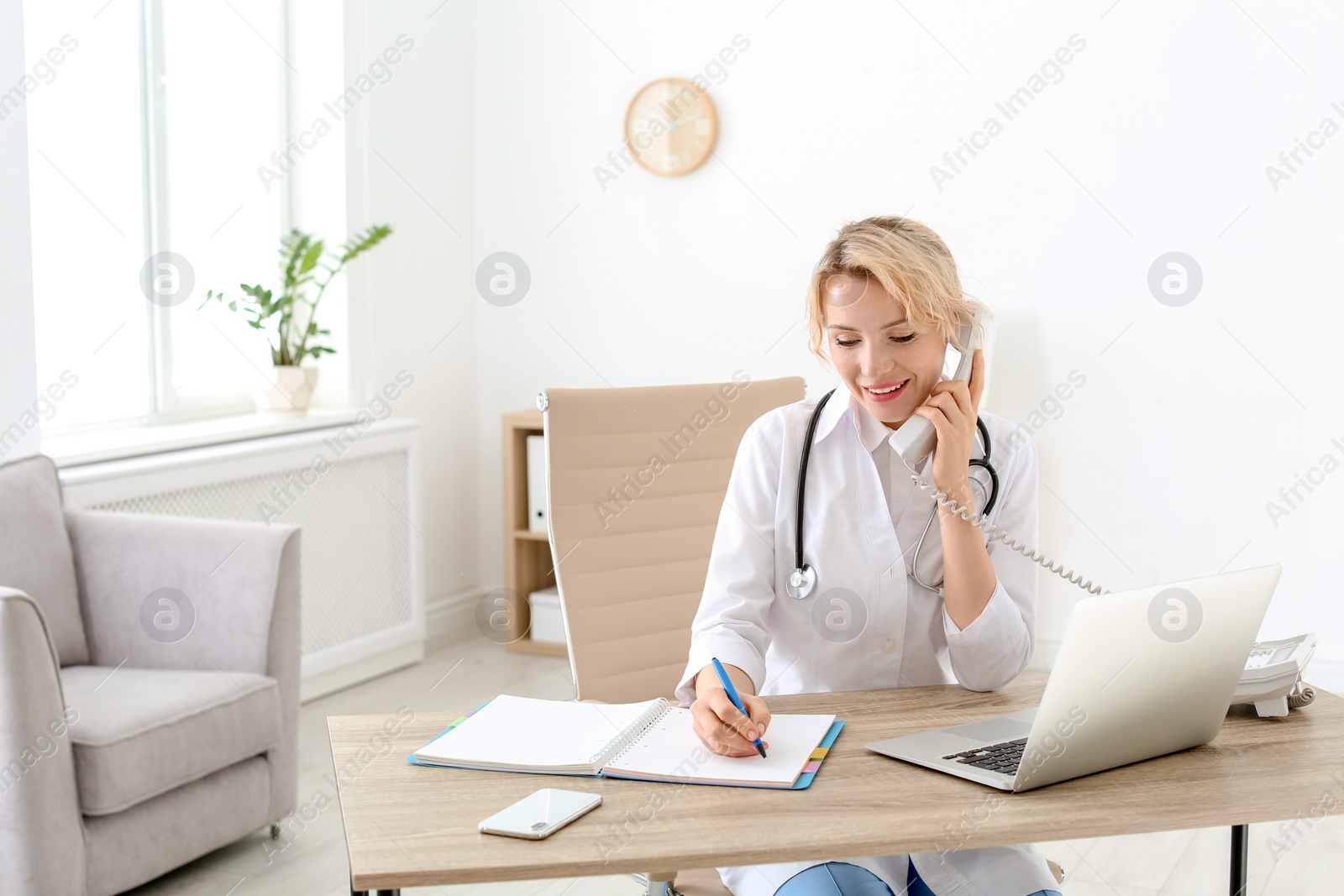 Photo of Female medical assistant at workplace in clinic. Health care service