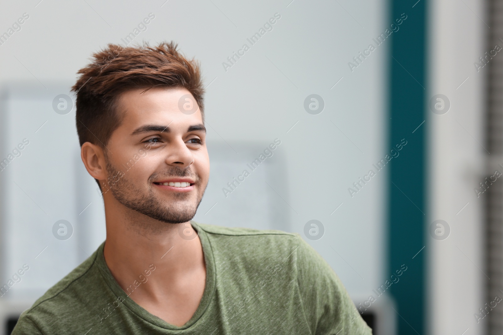 Photo of Portrait of handsome young man in room