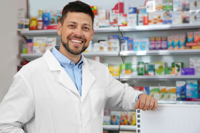 Image of Portrait of professional pharmacist in modern drugstore