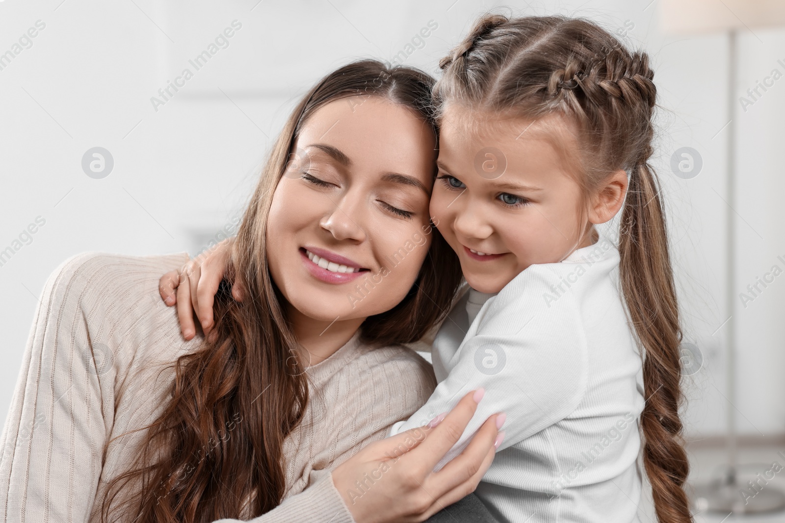 Photo of Happy mother with her cute daughter at home