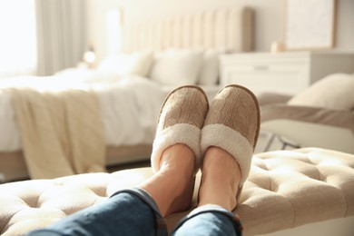 Photo of Woman wearing soft comfortable slippers at home, closeup