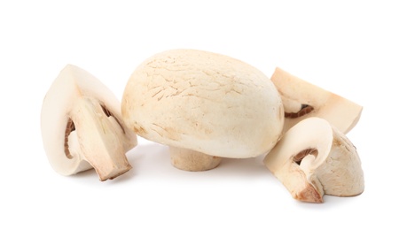 Fresh raw champignon mushrooms on white background