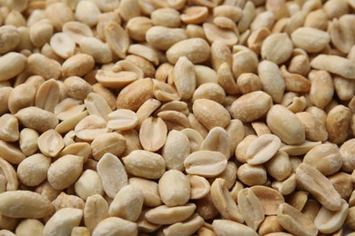 Many fresh peeled peanuts as background, closeup