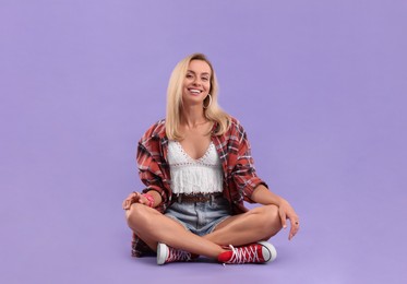 Photo of Portrait of happy hippie woman on purple background