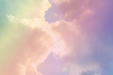 Fantasy world. Picturesque view of beautiful magic sky with fluffy clouds, toned in pastel rainbow or unicorn colors