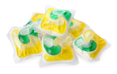 Photo of Pile of dishwasher detergent pods on white background