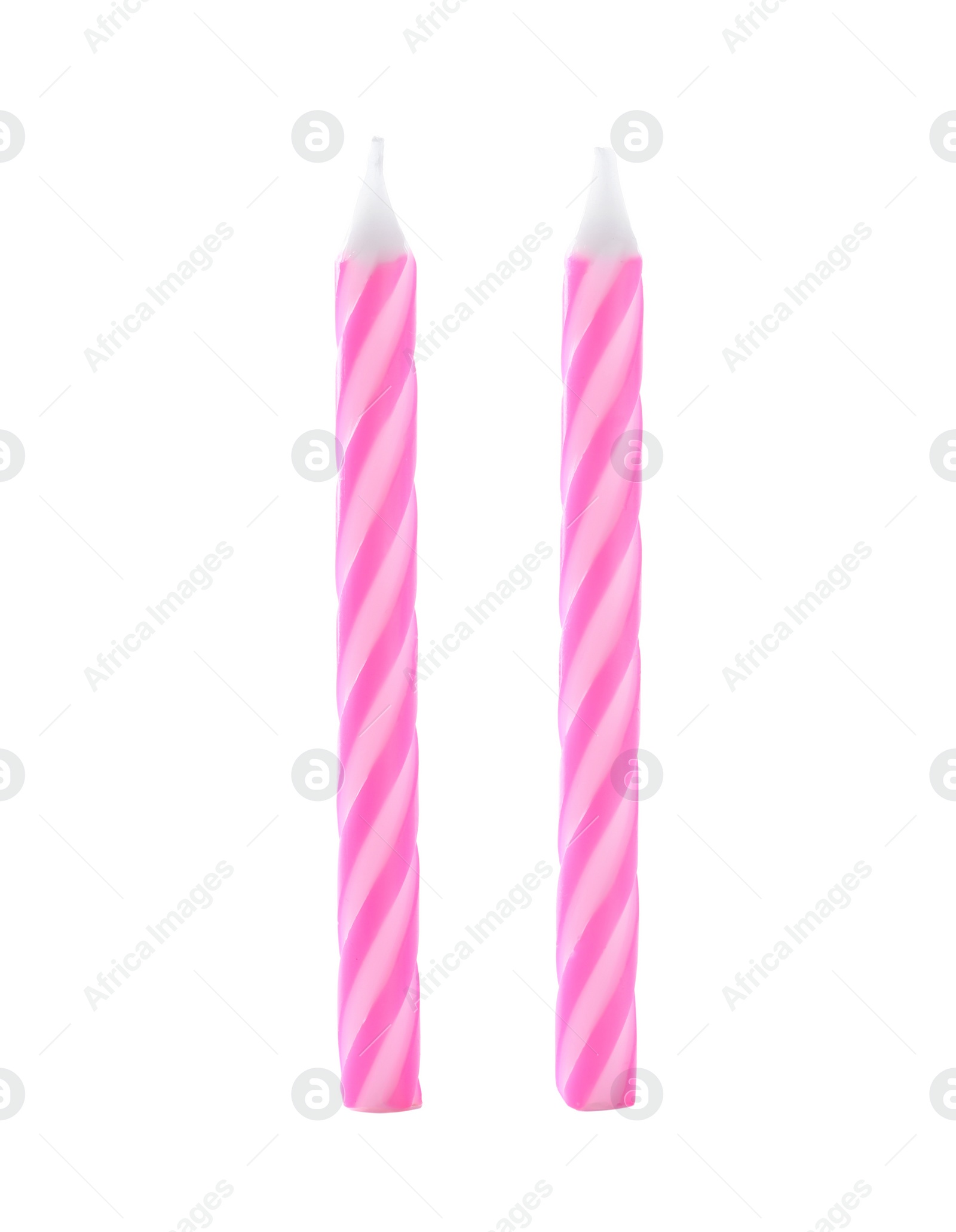 Photo of Pink striped birthday candles isolated on white