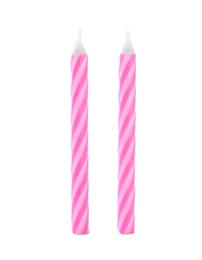 Pink striped birthday candles isolated on white