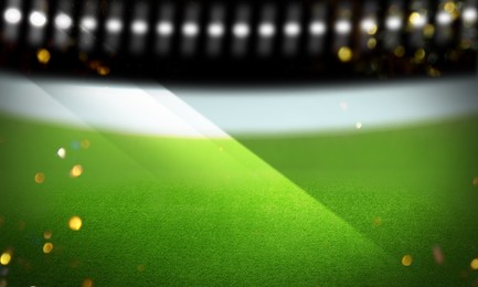 Image of Green sports field under stadium lights, bokeh effect. Banner design