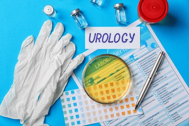 Photo of Flat lay composition with urine sample and test form on color background. Urology concept