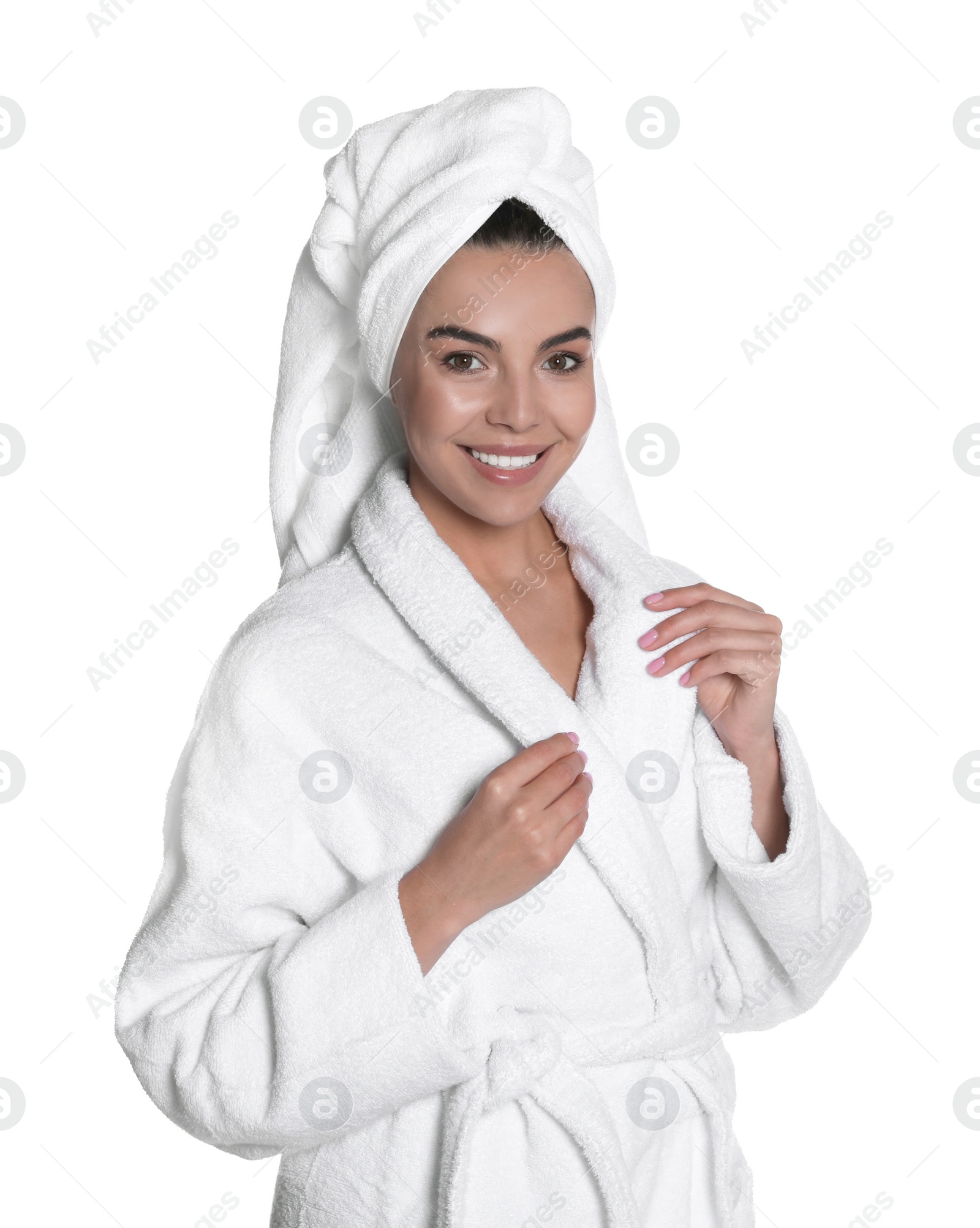 Photo of Beautiful young woman wearing bathrobe and towel on head against white background