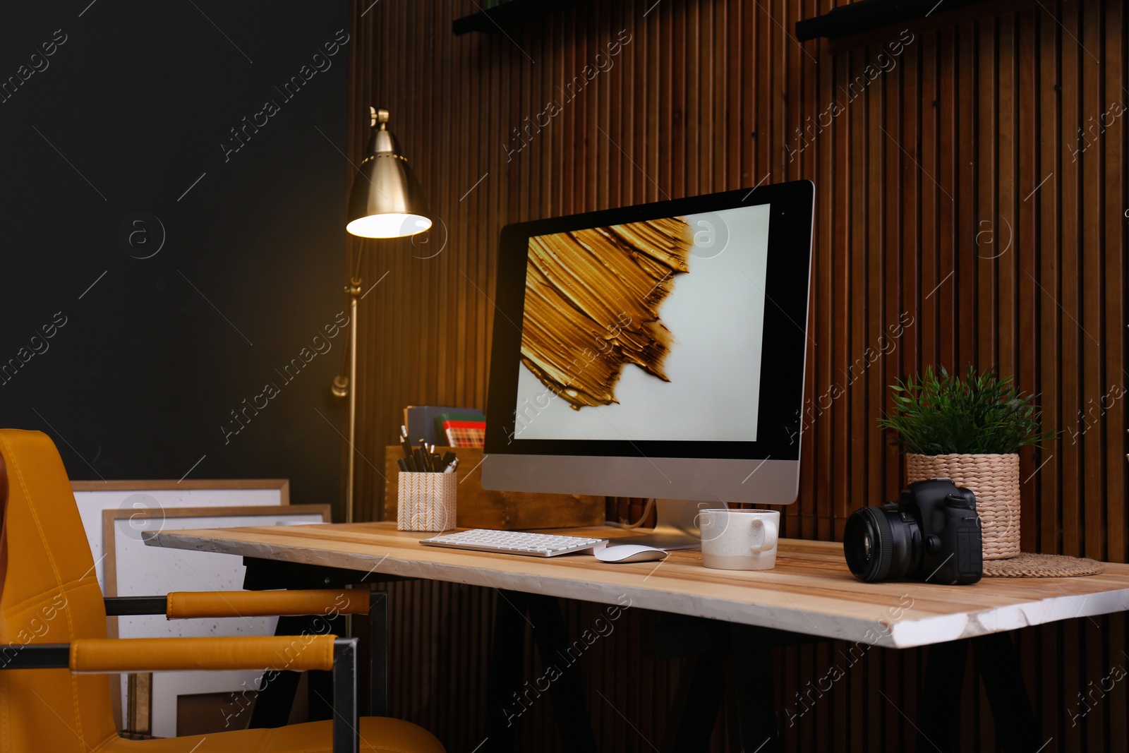 Photo of Modern computer on desk in room. Home workplace