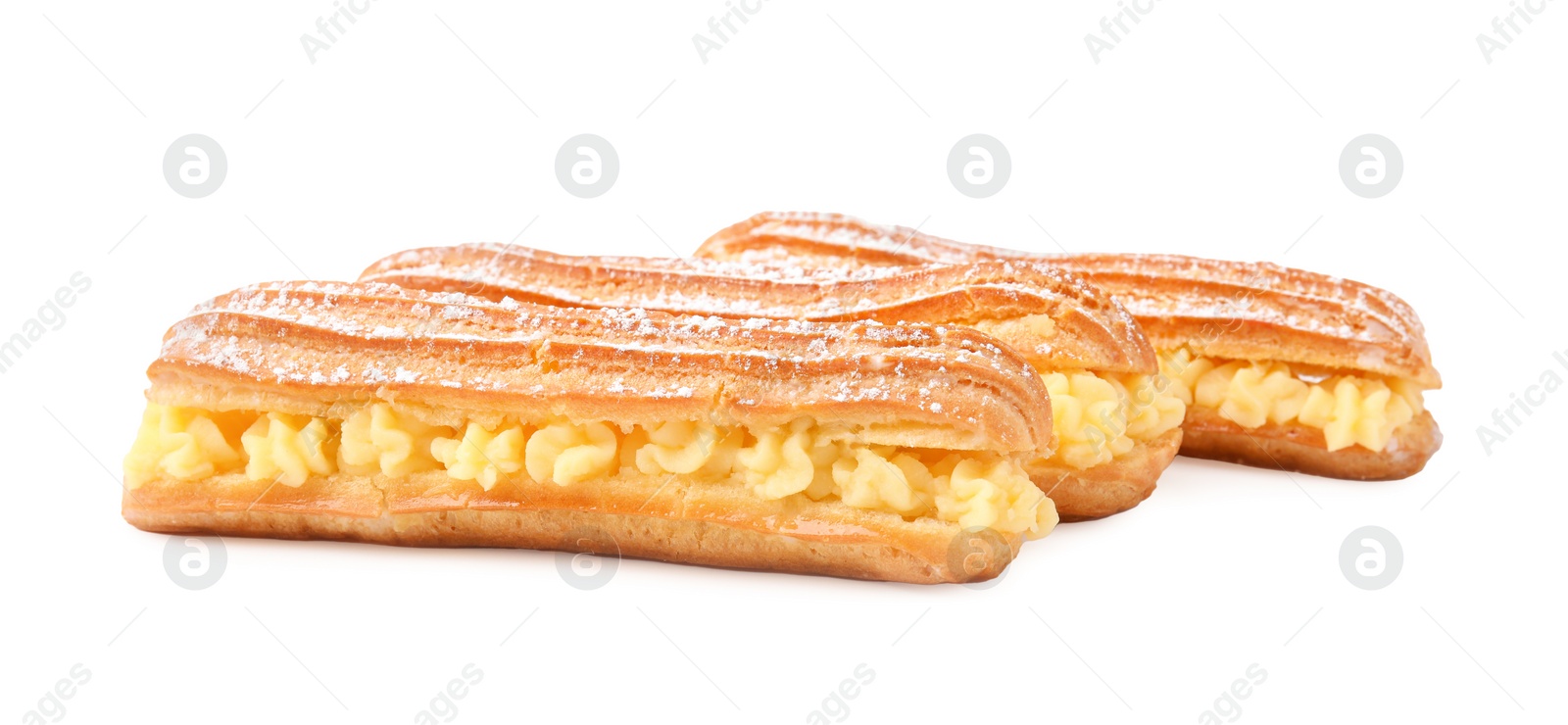 Photo of Delicious eclairs filled with cream isolated on white