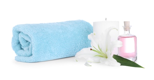 Composition with towel and fresh flower isolated on white. Spa treatment