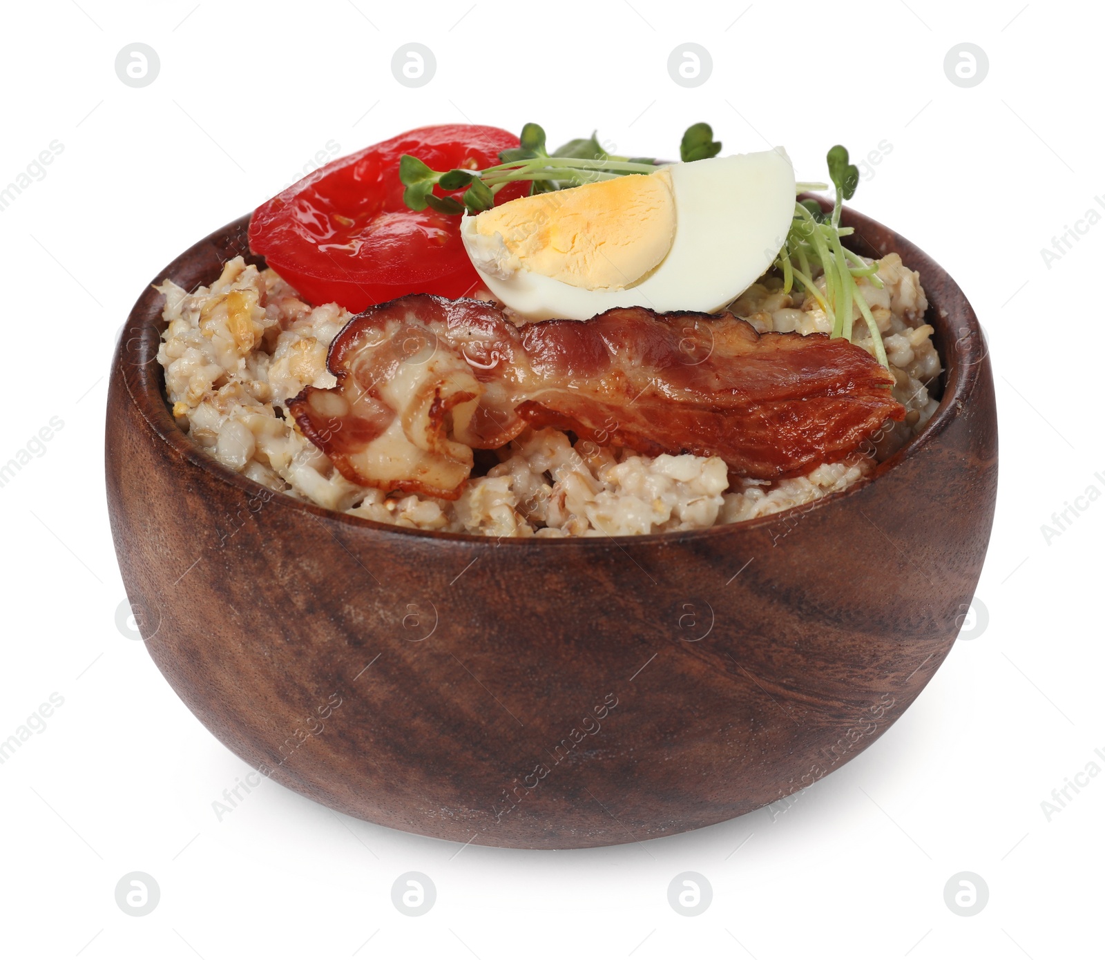 Photo of Delicious boiled oatmeal with egg, bacon and tomato in bowl isolated on white