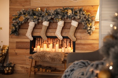 Stylish room interior with decorative fireplace. Christmas time