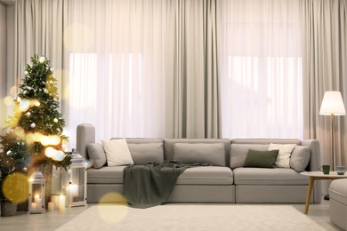 Image of Elegant living room interior with comfortable sofa and Christmas decor