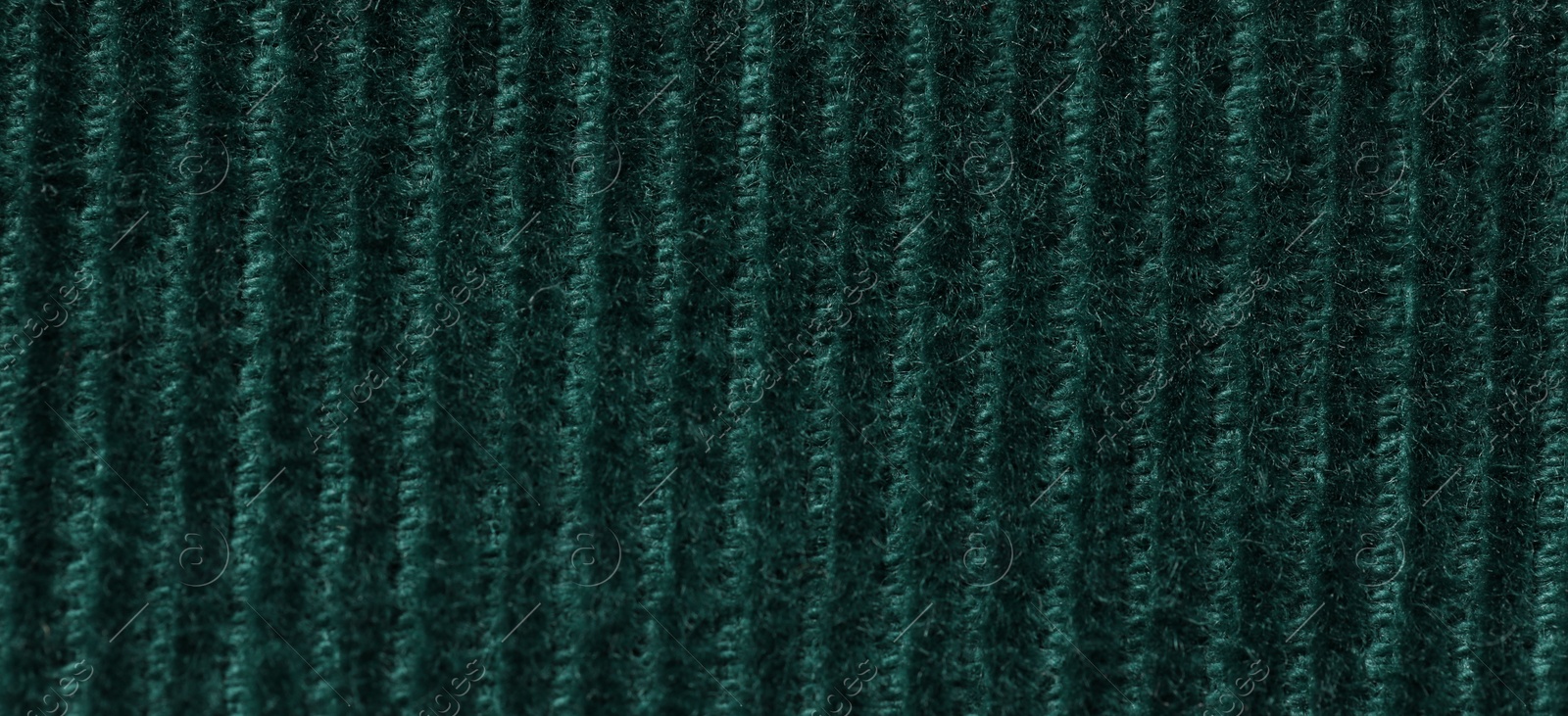 Photo of Texture of soft dark green knitted fabric as background, top view