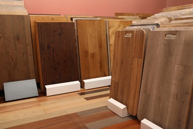 Photo of Many different samples of wooden flooring in store