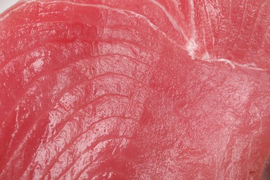 Photo of Fresh raw tuna fillet as background, top view