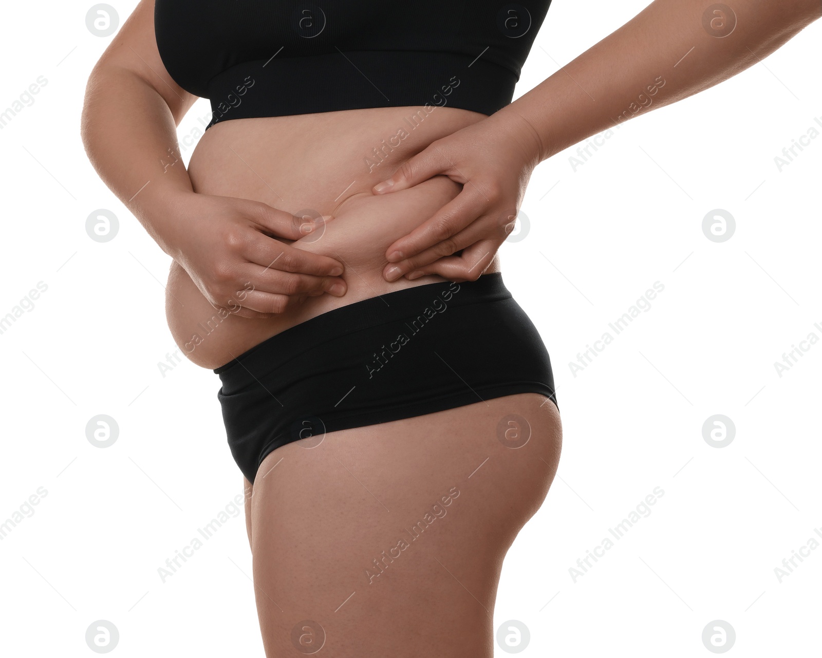 Photo of Woman touching belly fat on white background, closeup. Overweight problem