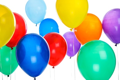 Photo of Colorful balloons on white background. Celebration time