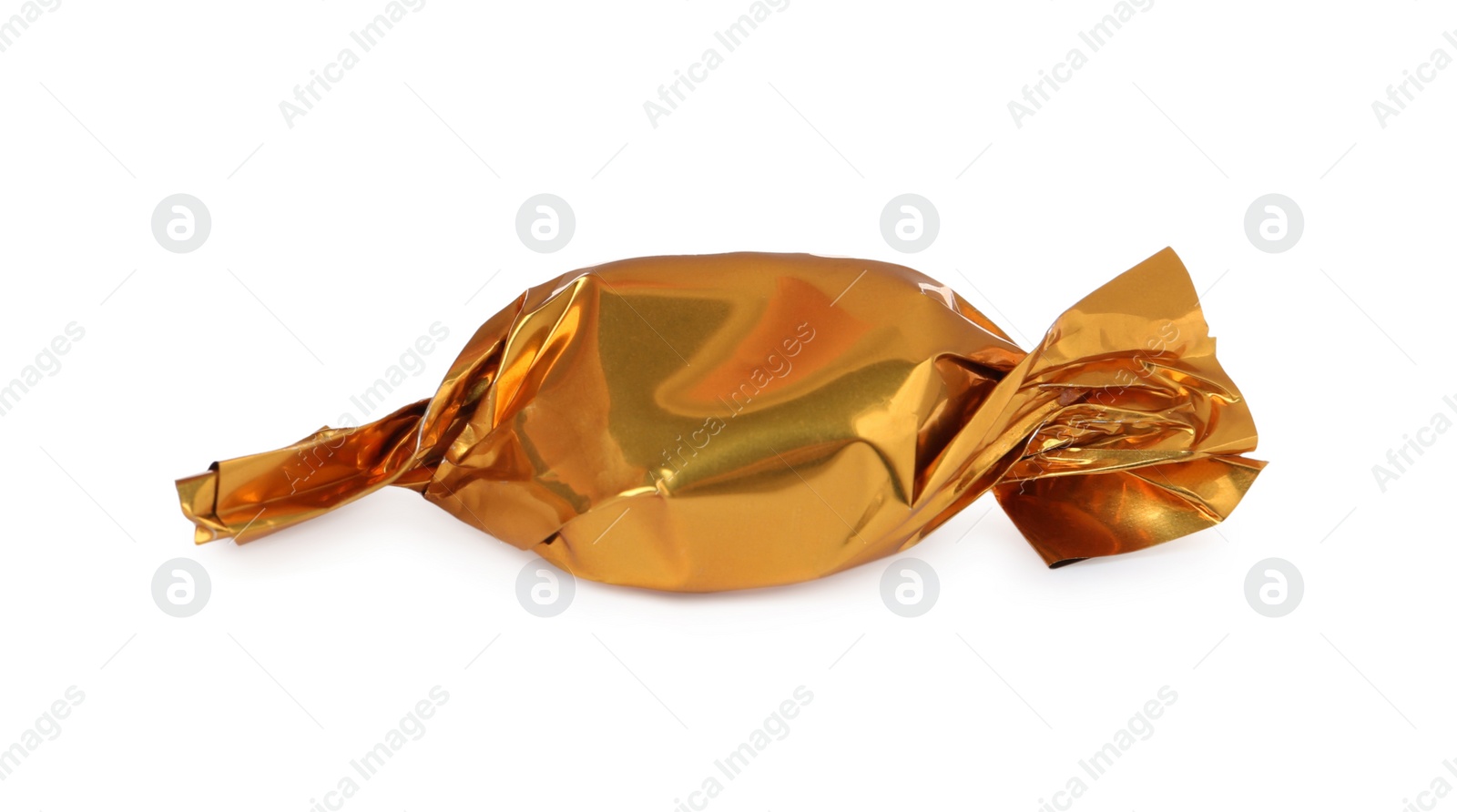 Photo of Delicious candy in golden wrapper isolated on white