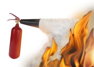 Putting out flame with fire extinguisher on white background