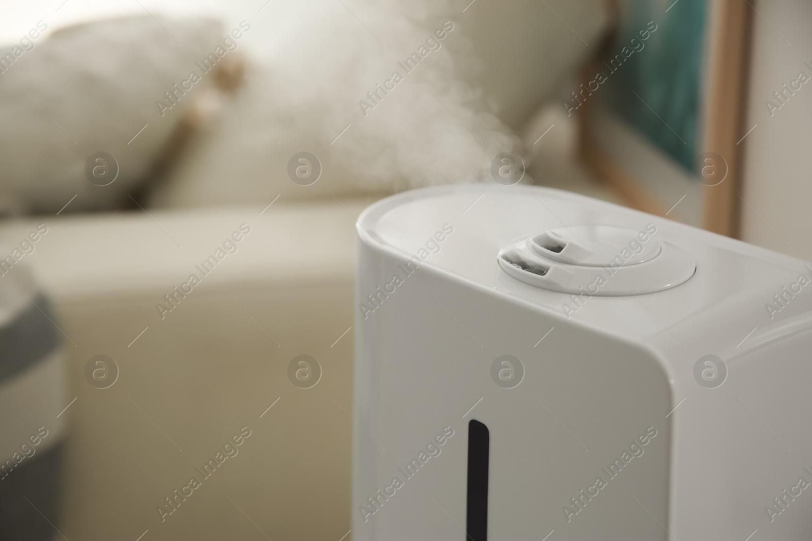 Photo of Modern humidifier indoors, closeup. Space for text