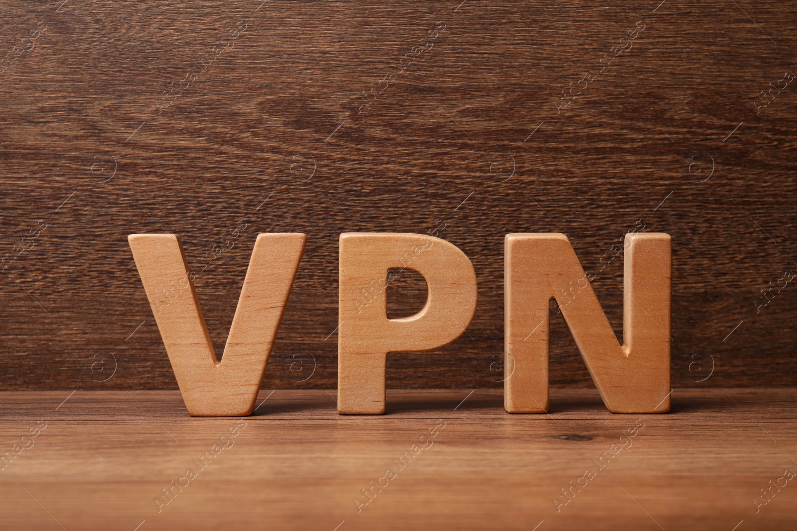 Photo of Acronym VPN made of wooden letters on table