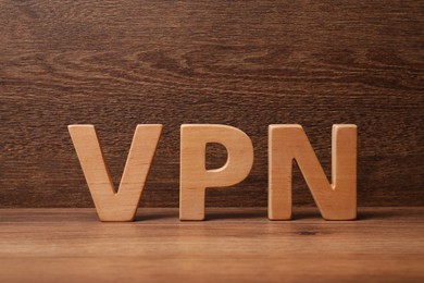 Photo of Acronym VPN made of wooden letters on table