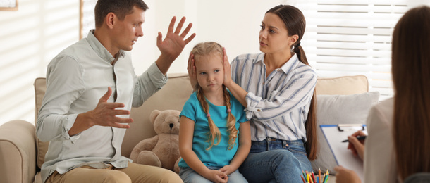 Image of Family on appointment with child psychotherapist indoors