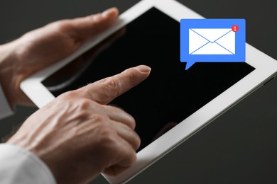 Image of Email. Man using tablet against dark background, closeup. Incoming letter notification over device