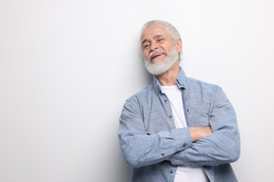 Portrait of handsome senior man on white background. Space for text