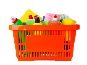 Photo of Shopping basket full of detergents on white background