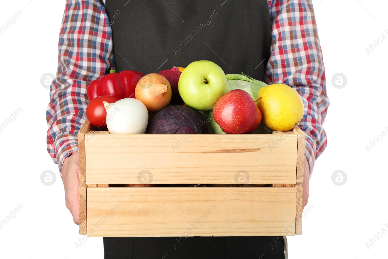 Photo of Man holding wooden crate filled with fresh vegetables and fruits against white background, closeup