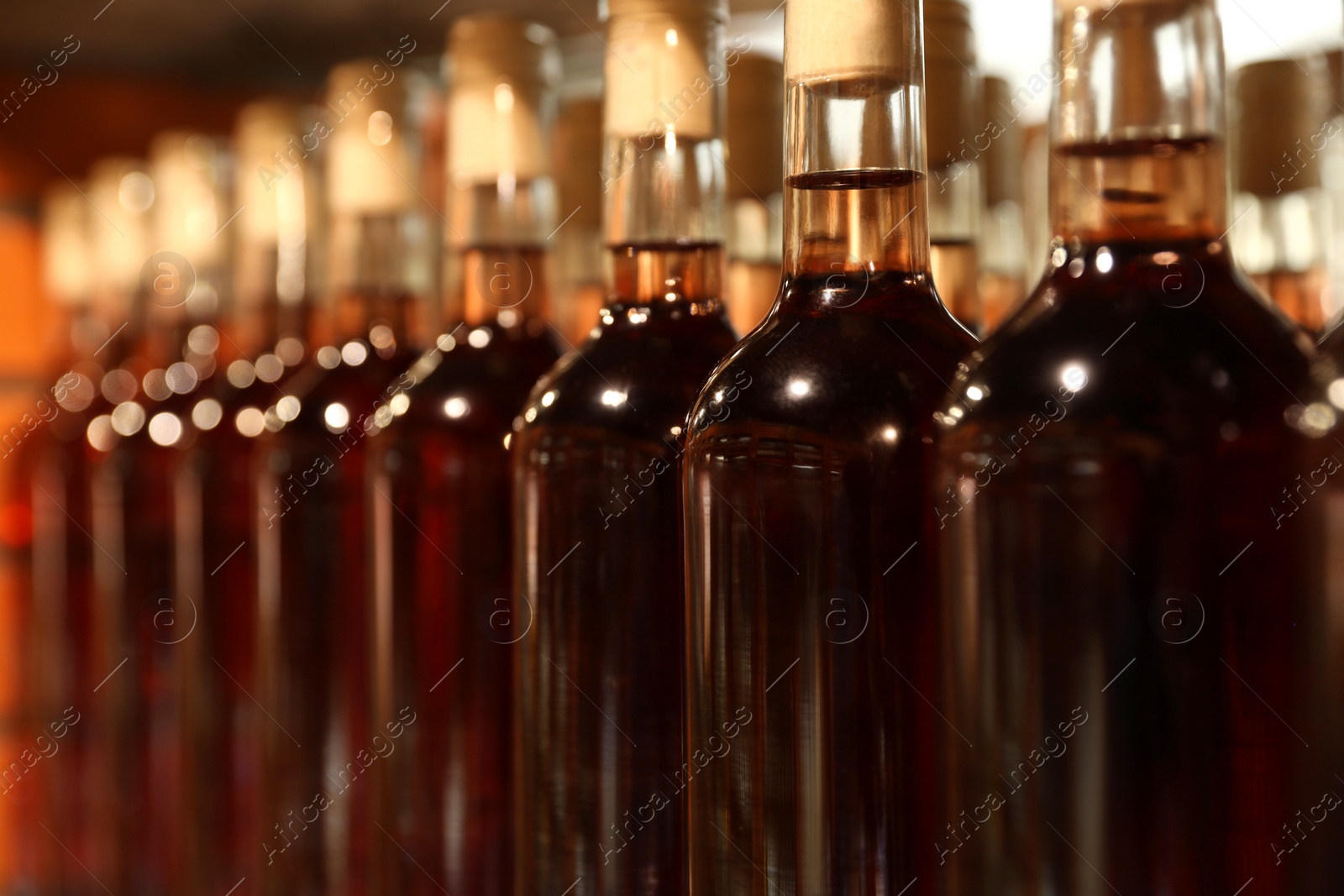 Photo of Many bottles of alcohol drinks, closeup view