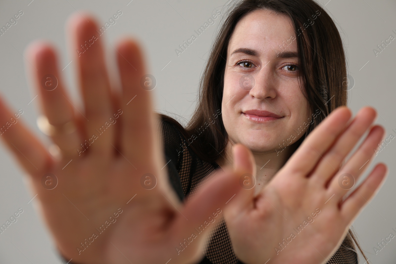 Photo of Beautiful young woman on light grey background