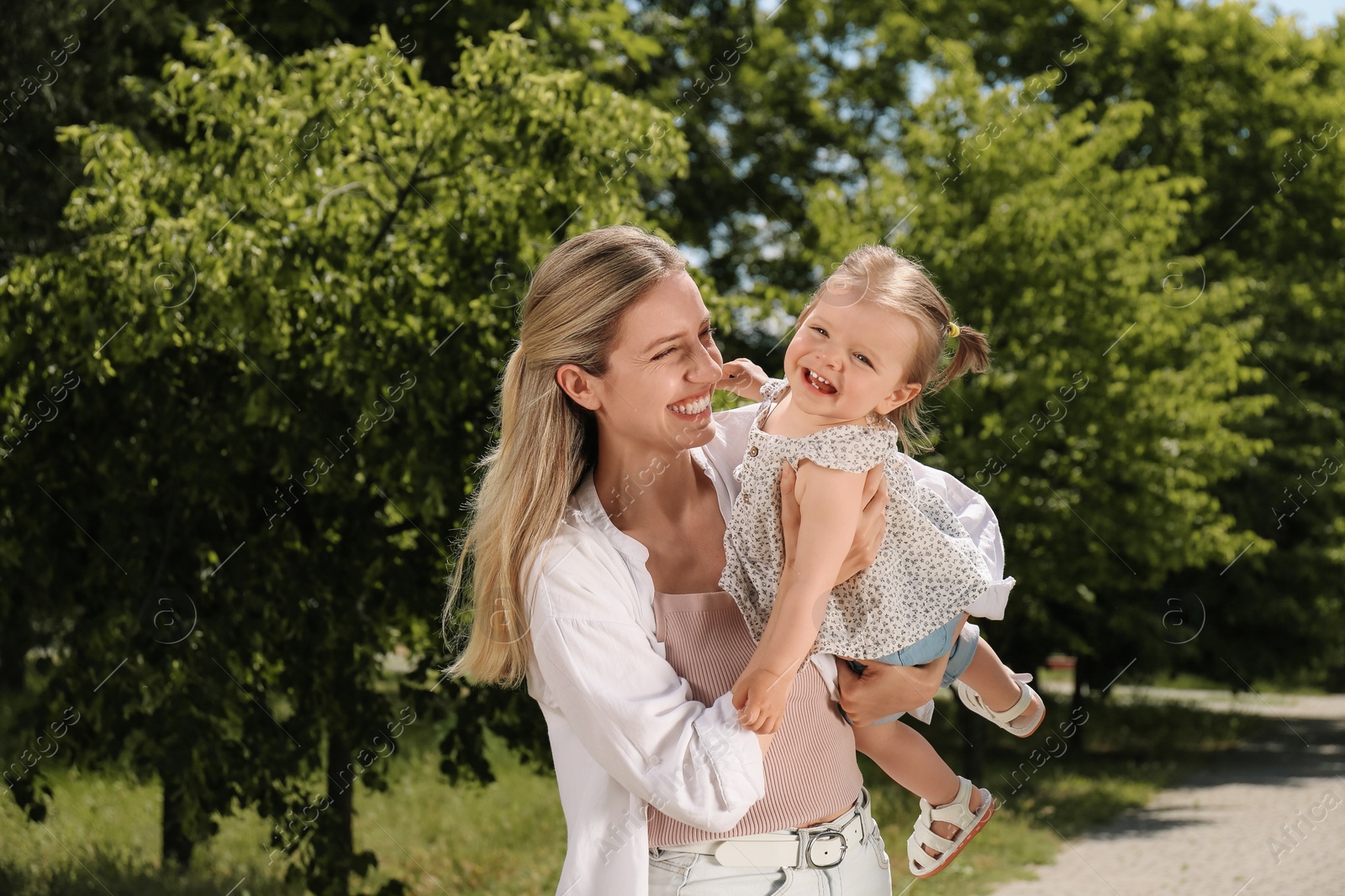 Photo of Happy mother with her daughter having fun in park