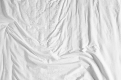 Crumpled white fabric as background, top view