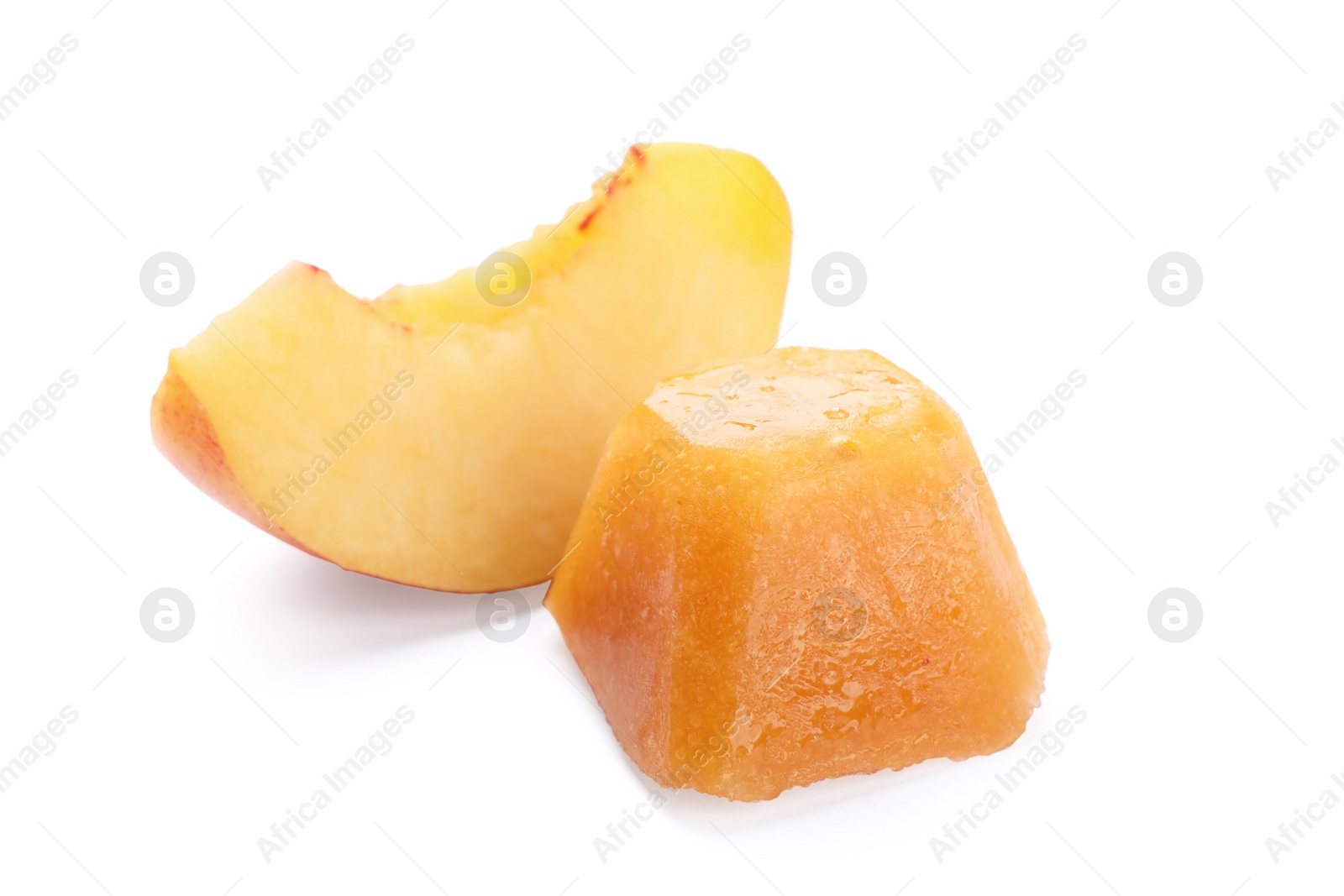 Photo of Frozen nectarine puree cube and fruit on white background