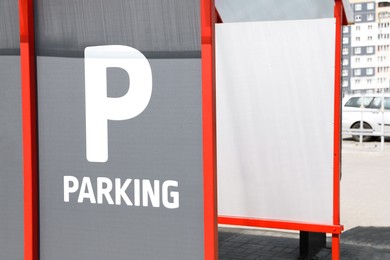 Photo of Sign with word Parking on city street, closeup