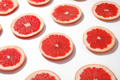 Photo of Fresh sliced ripe grapefruits on white background