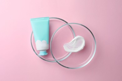 Petri dishes and cosmetic product on pink background, flat lay
