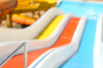 Blurred view from colorful slides in water park