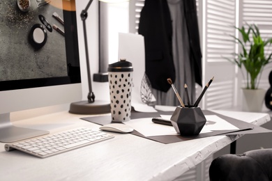 Photo of Stylish workplace with modern computer on desk