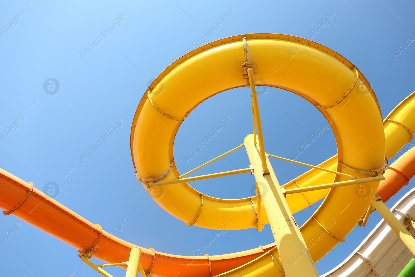 Photo of Colorful slides in water park, bottom view